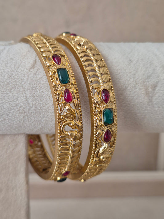 Esha Bangles set of 2, traditional Indian gold-plated bangles with red and green stones, ethnic festive and wedding jewelry collection by Naitri.in