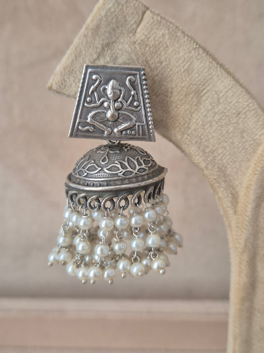 Modern Indian aesthetic silver-plated statement earrings featuring textured square studs and classic jhumka bells by naitri.in