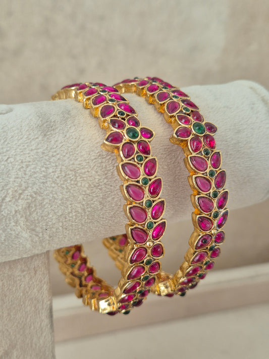 Maanya Bangles set of 2 – traditional gold-plated ethnic bangles with pink and green stone work by Naitri.in