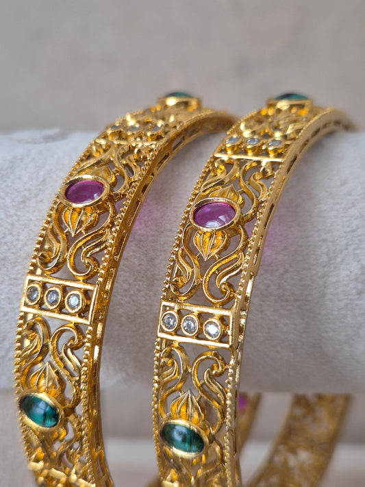 Nagma Bangles set of 2, traditional Indian gold-plated bangles with red and green stones, ethnic festive and bridal jewelry collection by Naitri.in