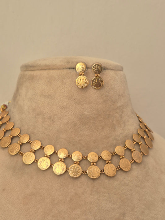 Gold coin-style choker necklace with matching circular stud earrings by naitri.in