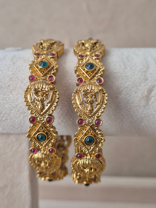 Vaina Bangles set of 2, traditional Indian gold-plated bangles with red and green stones, ethnic festive and bridal jewelry collection by Naitri.in