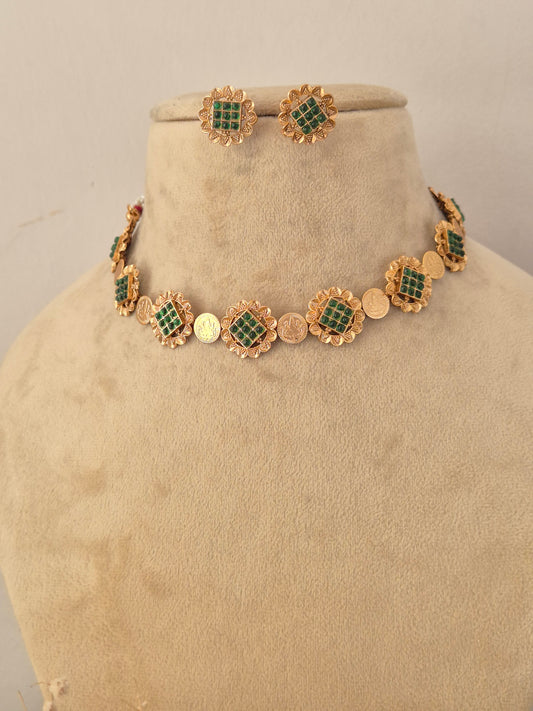 Traditional imitation choker necklace and stud earrings crafted with brass alloy and green stone studded round links by naitri.in