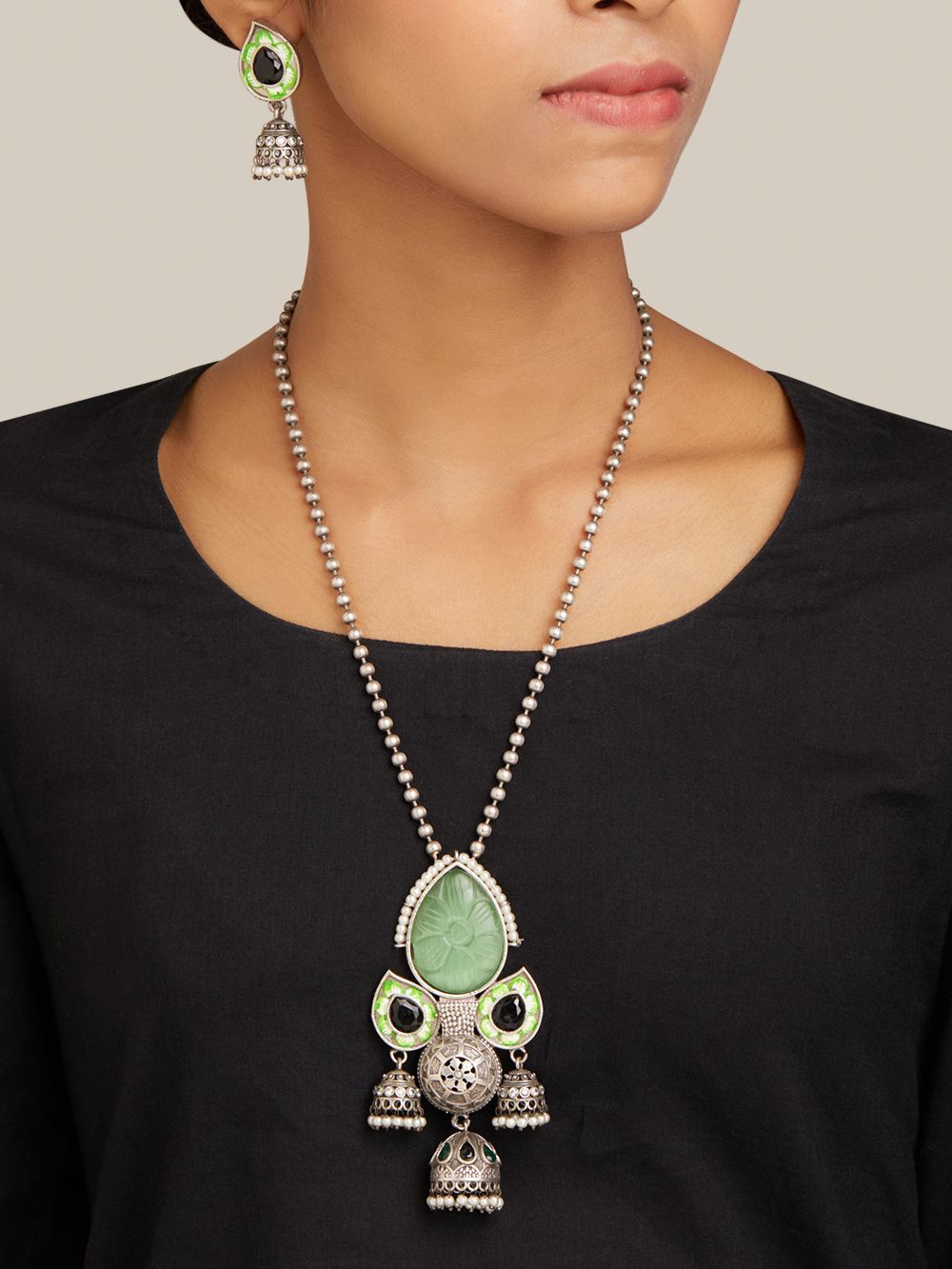 Green and red statement necklace set, Oni by Naitri, drop style seen on bust.