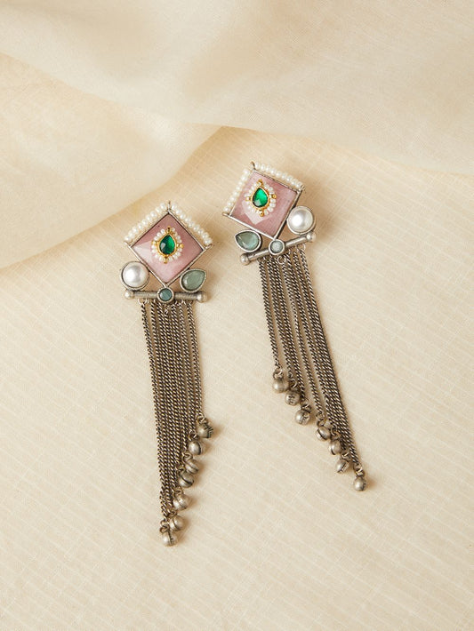 Red and pink stud earrings, Kajal by Naitri, stone design on white.