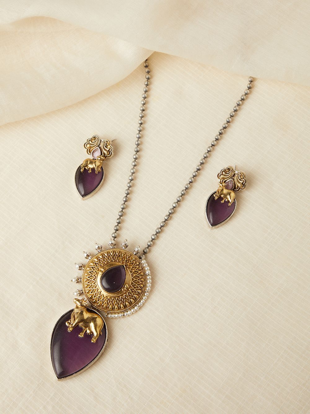 Dual-tone purple and gold necklace set, Ishani by Naitri, statement centerpiece.