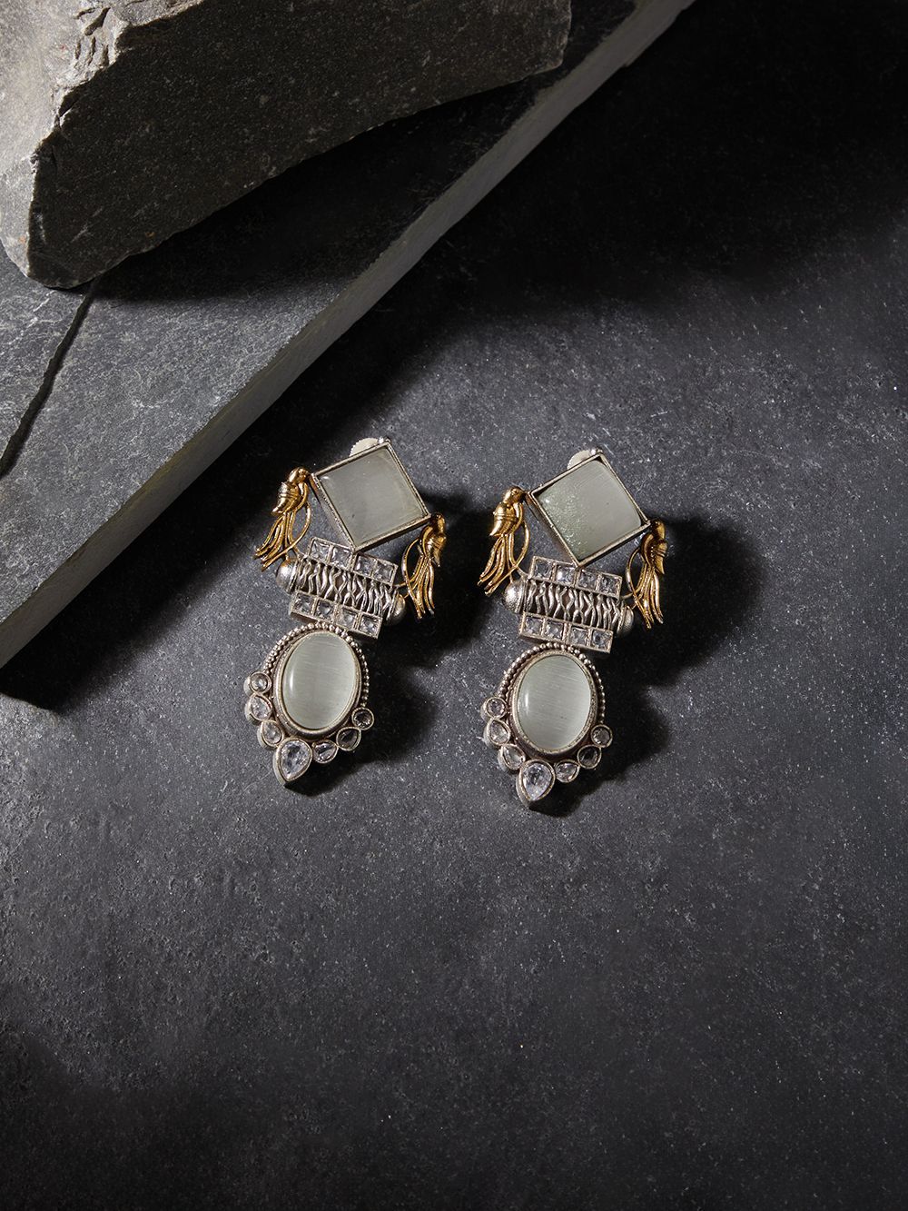 Gold and white dangle earrings, Cheena by Naitri, ethnic style shown upright.