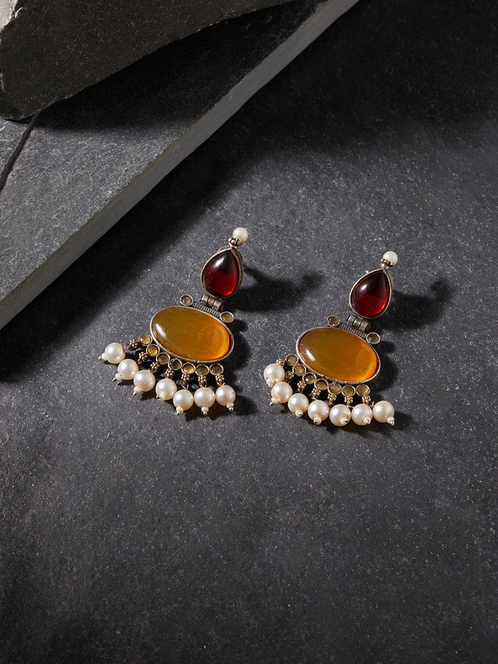 Red and yellow stud earrings, Bindu by Naitri, festive colorful design.