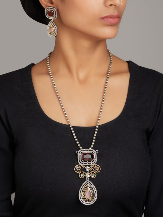 Red pendant necklace set, Vira by Naitri, statement jewelry on soft background.
