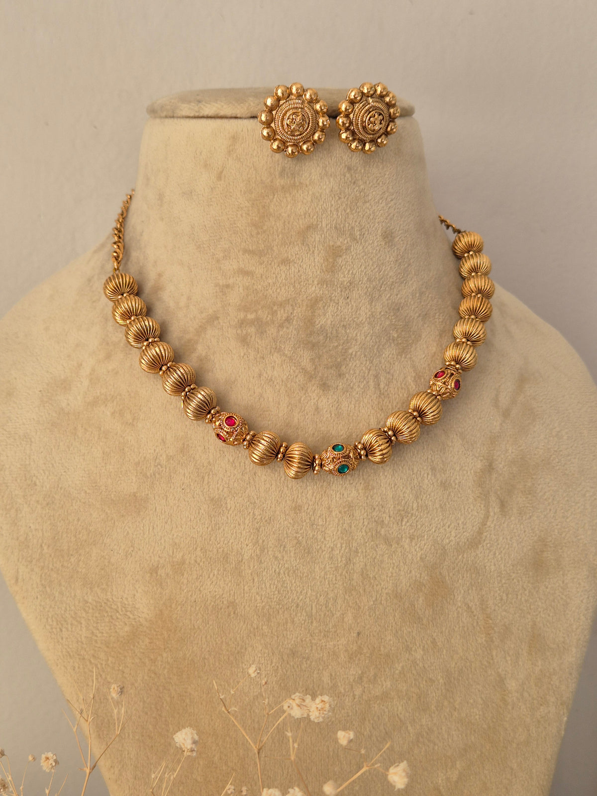 Gold-toned Alisha bead necklace set with matching earrings by Naitri.in