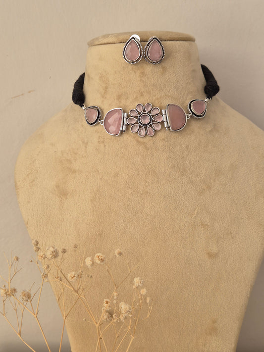 Elegant ethnic choker necklace with soft pink floral centerpiece designs, complemented by matching traditional earrings by Naitri.in