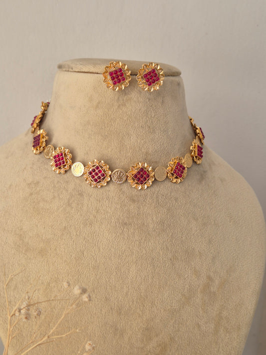 Traditional Indian Imitation Jewelry Set showcased against a clean background, highlighting the intricate red gemstone detailing, polished gold-tone finish, and classic ethnic craftsmanship by Naitri.in