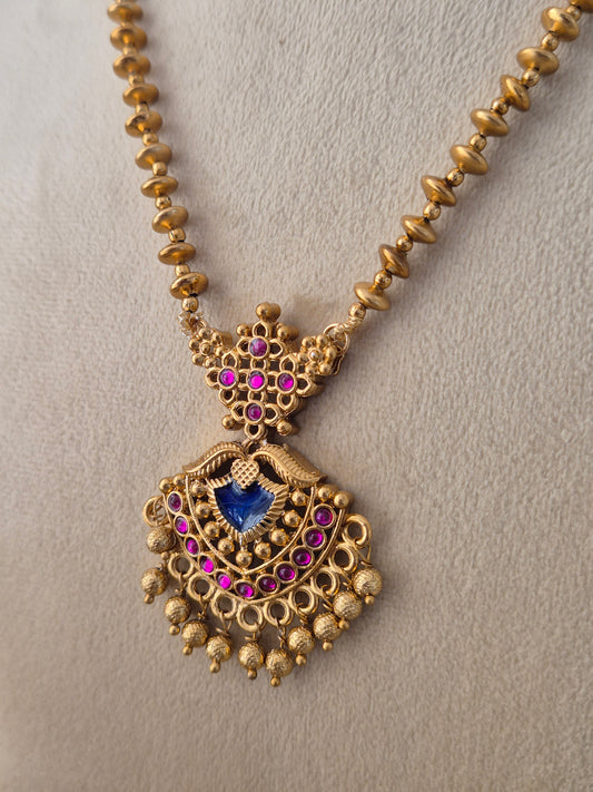 Gold-plated traditional Ananya necklace and earring set with gold beaded chain by Naitri.in