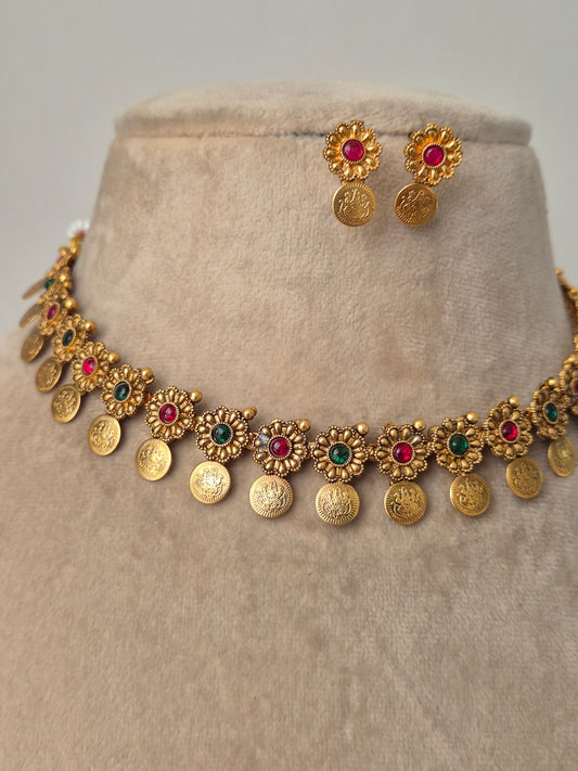 "Handcrafted gold-plated necklace with red-green stones coins drops same designed studded earrings by naitri.in