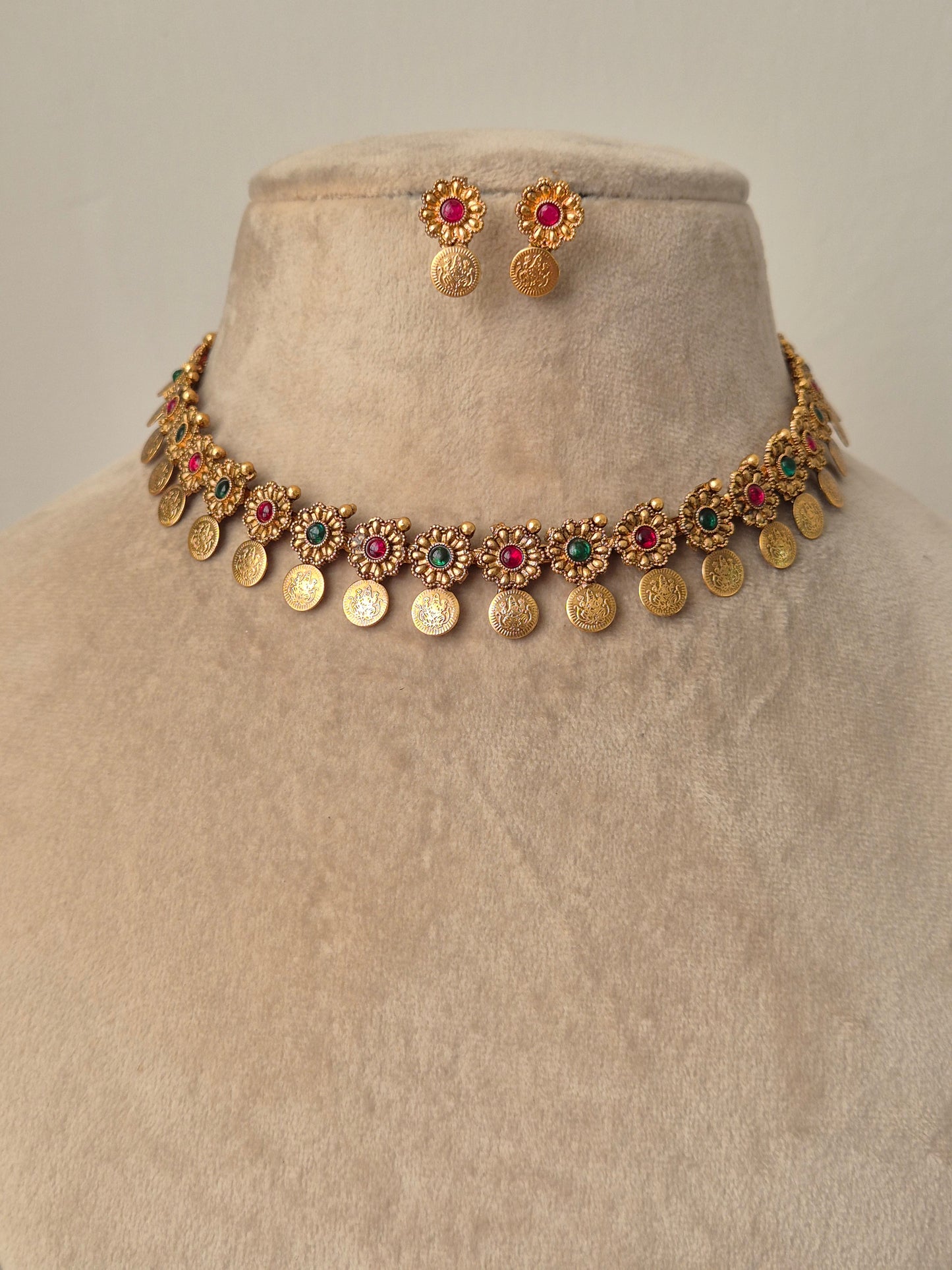 Gold necklace with colorful stones brass necklace flora and coin designed and colourful stones by naitri.in