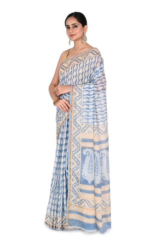 Detailed view of traditional Bagh hand block printing from Madhya Pradesh on a beige and blue Maheshwari cotton silk saree by naitri.in