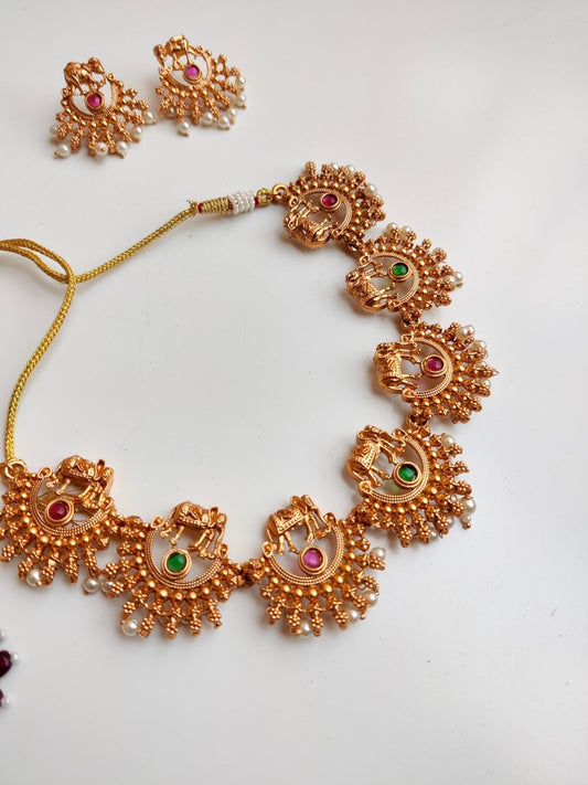 Antique gold-plated Royal Temple Jewellery Necklace Set with red and green stones.