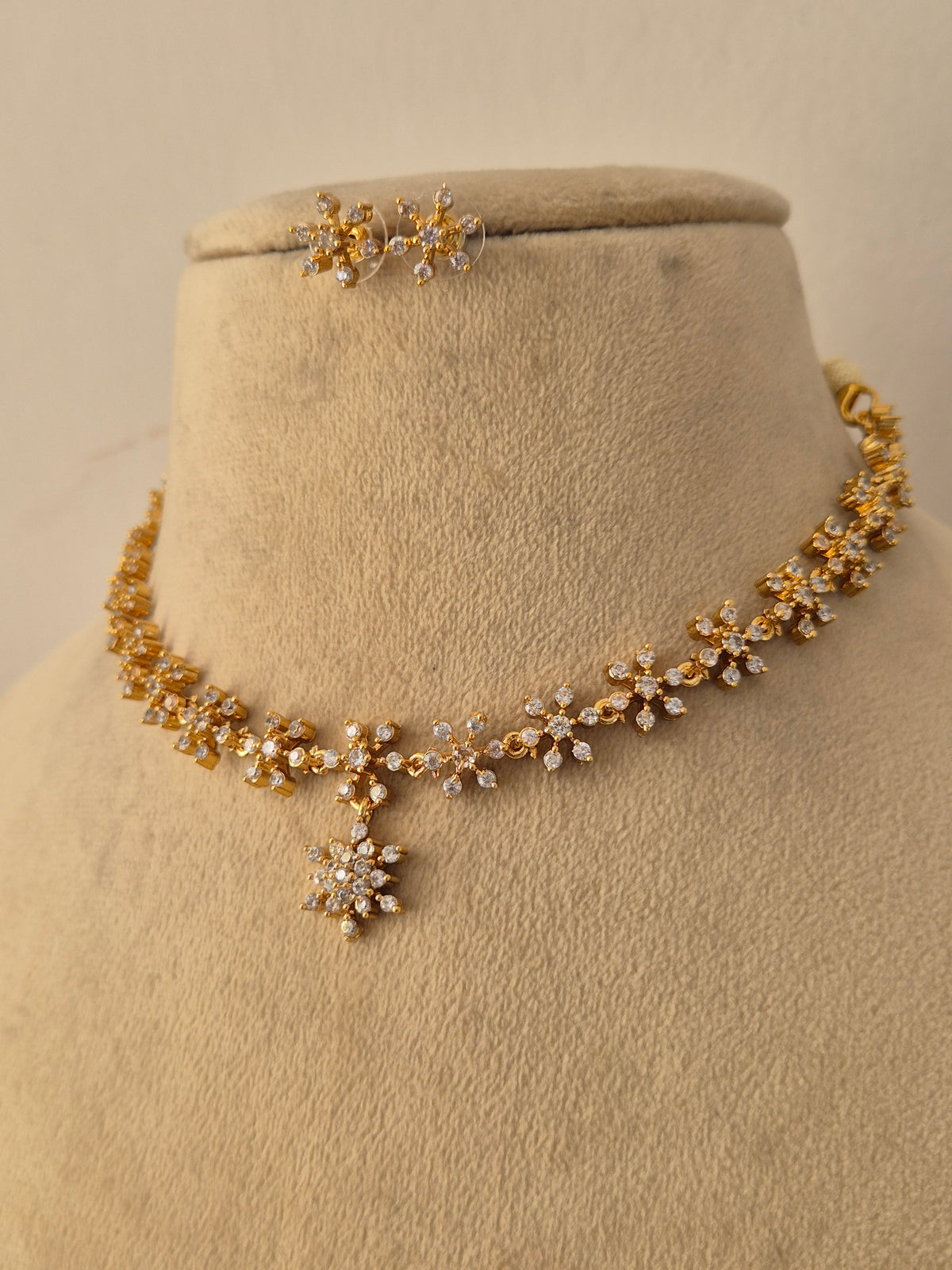 Handcrafted brass alloy choker necklace and matching earrings by Naitri.in