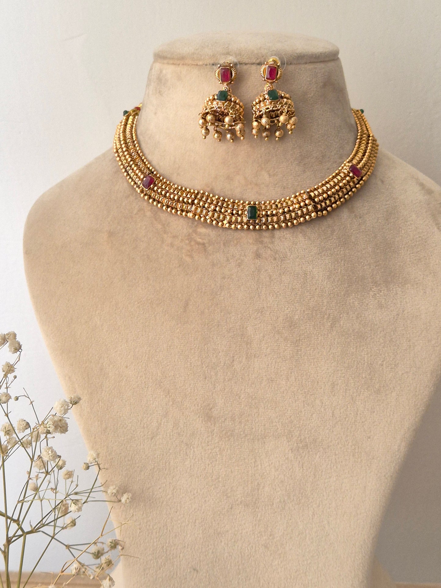 Traditional elegant necklace set with green and red stones with Jhumki available at naitri.in