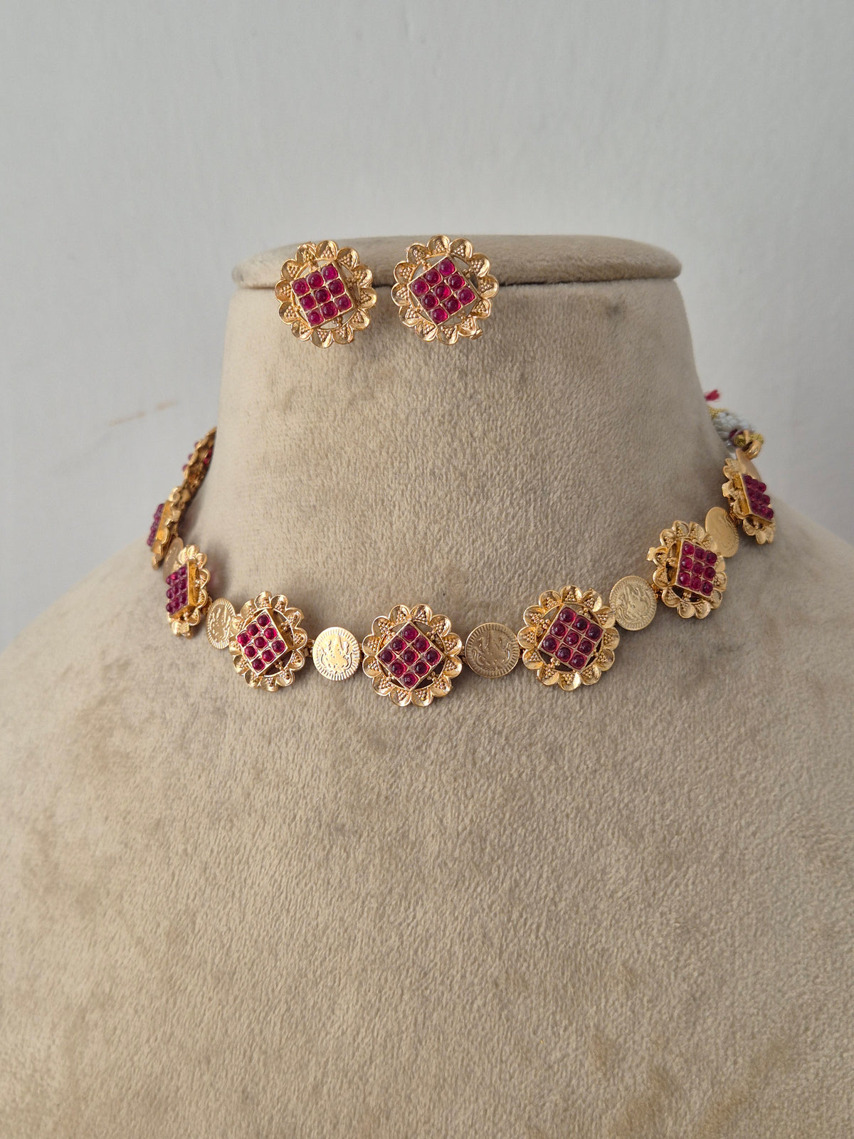 Handcrafted Brass Alloy Choker with eye-catching pink gemstone clusters, offering a lightweight and elegant ethnic look designed for festive, traditional, and everyday wear by Naitri.in