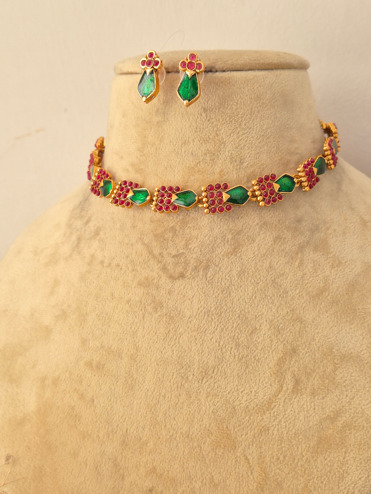 Vasundhara Necklace Set with green and pink stones and matching earrings by Naitri.in