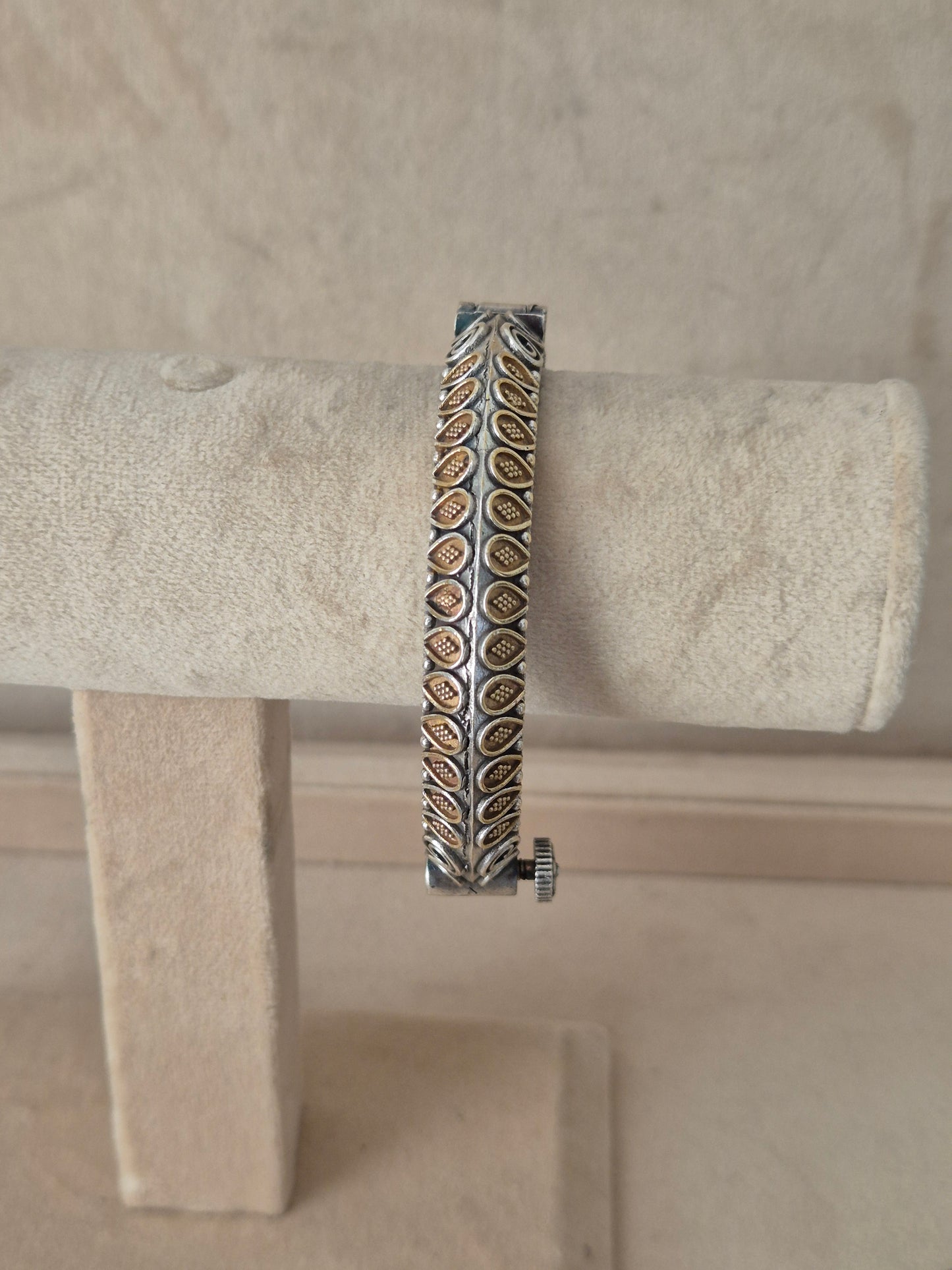 Dual-toned gold and silver Windiya openable bangle with textured geometric blocks. Elegant dual-tone ethnic cuff bracelet with traditional Indian detail by naitri.in