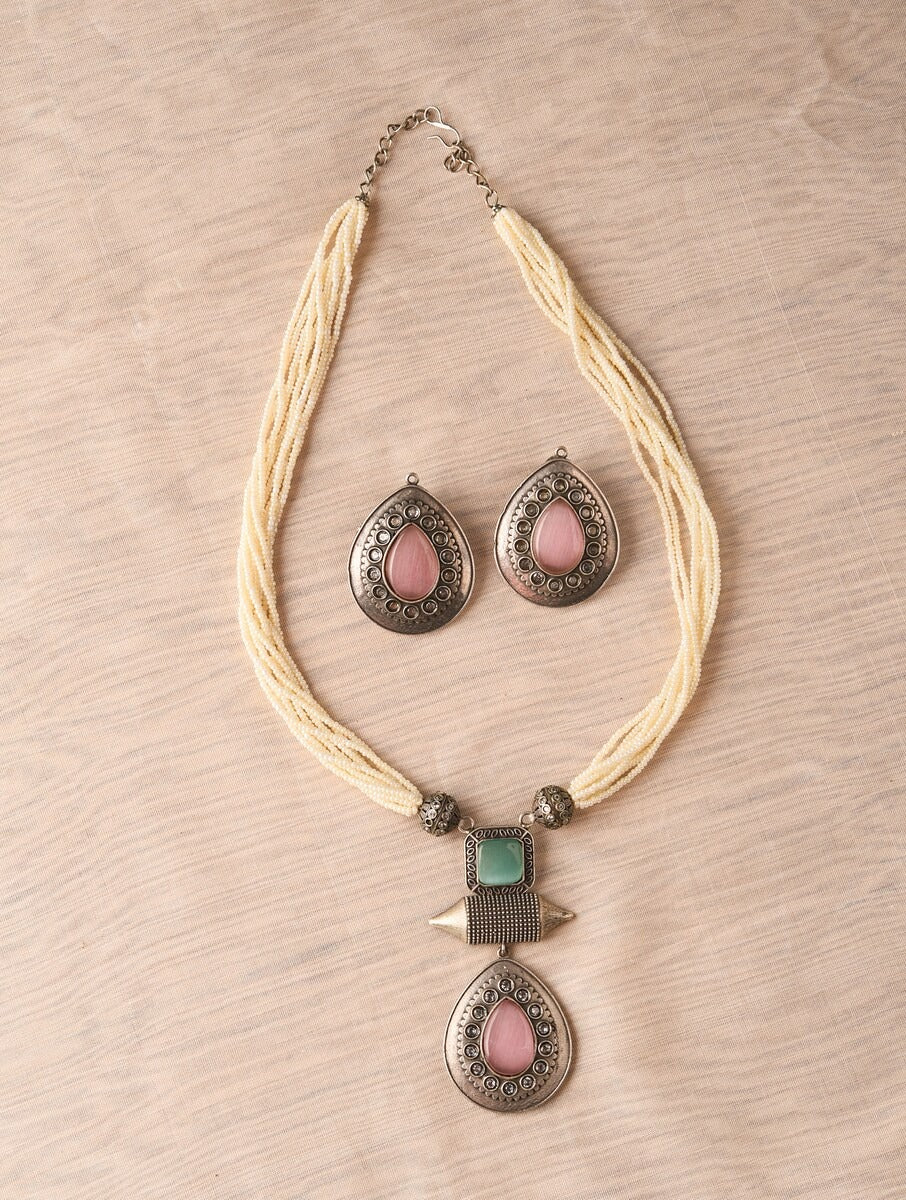 Beige and silver beaded necklace set, Resha by Naitri, with matching earrings.