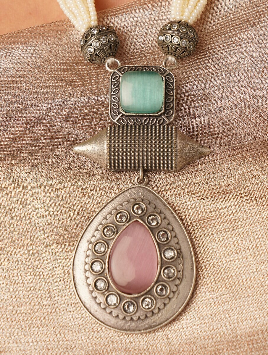 Beige and silver beaded necklace set, Resha by Naitri, with matching earrings.