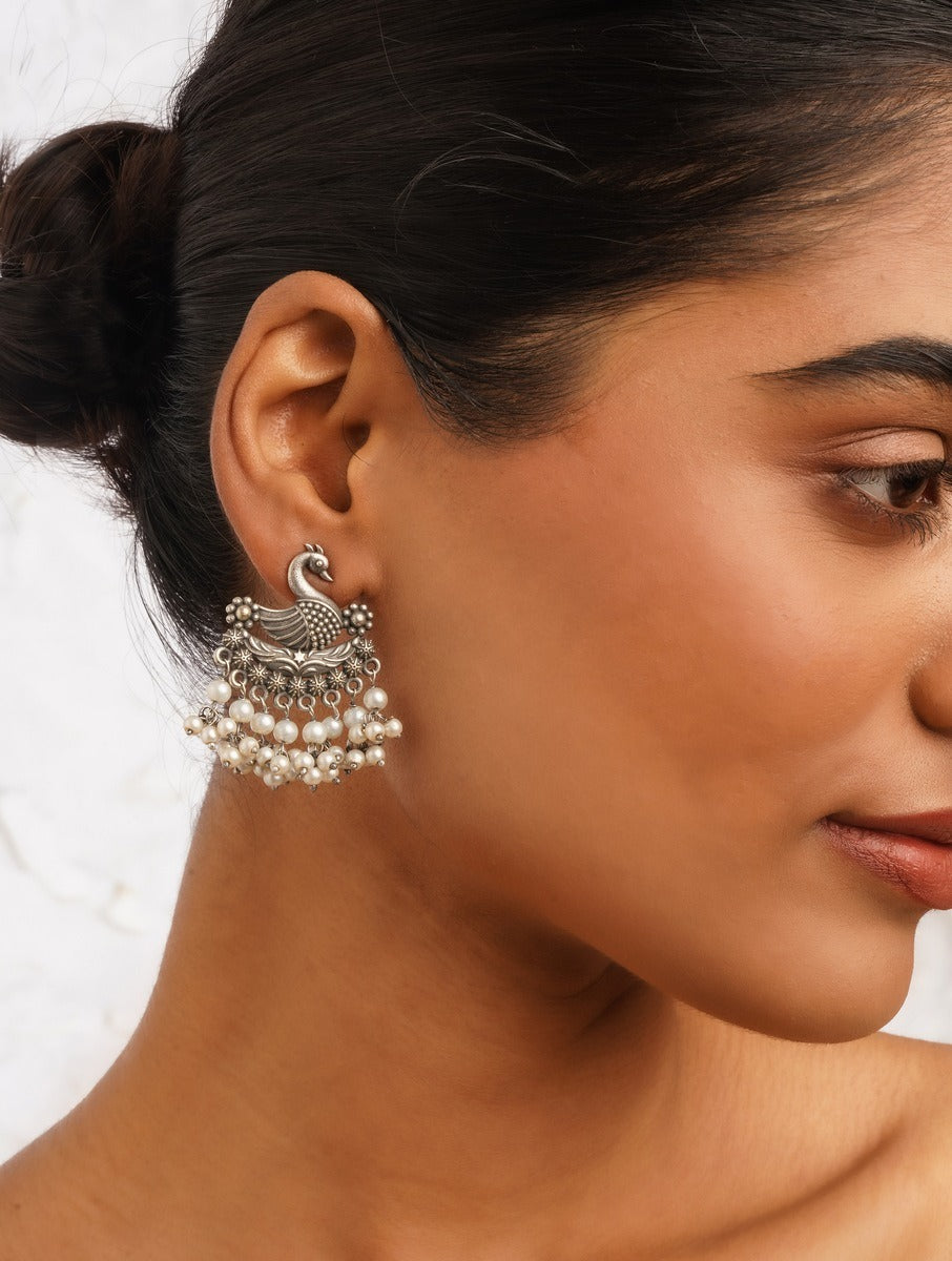 Long silver dangle earrings, Mrigya by Naitri, modern oxidized design.