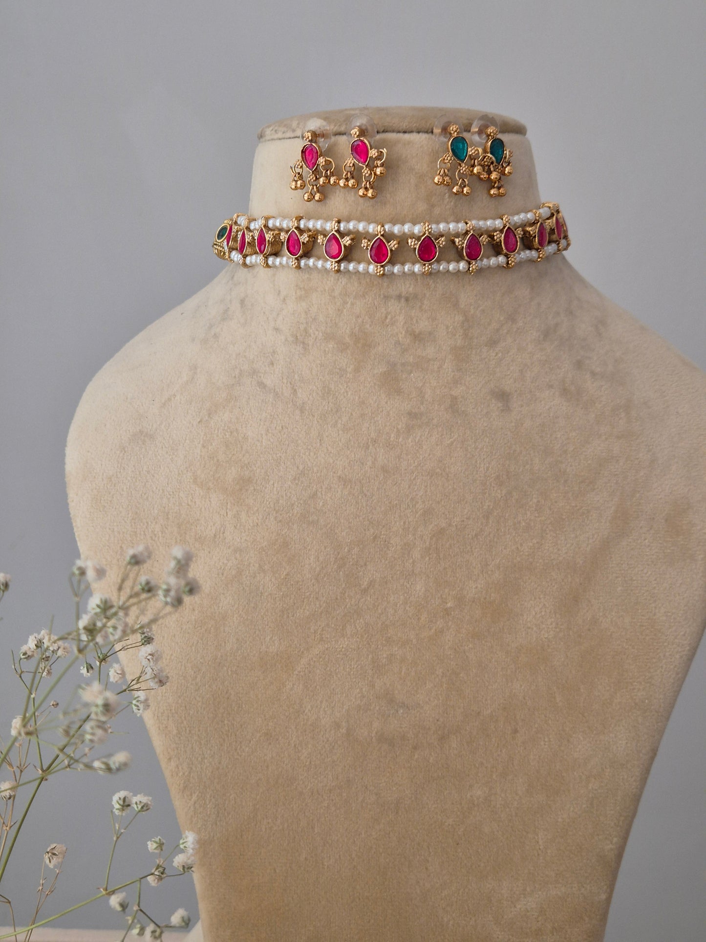 Reversible Tisha choker set in a modern Indian aesthetic, featuring a pearl and blue-pink stones design that offers a versatile, two-in-one jewelry look