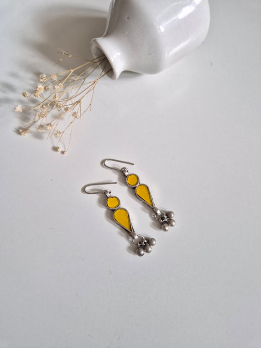 Yellow glass dangle earrings, close-up for handmade detail
