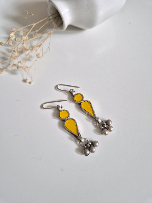 Yellow glass dangle earrings, close-up for handmade detail