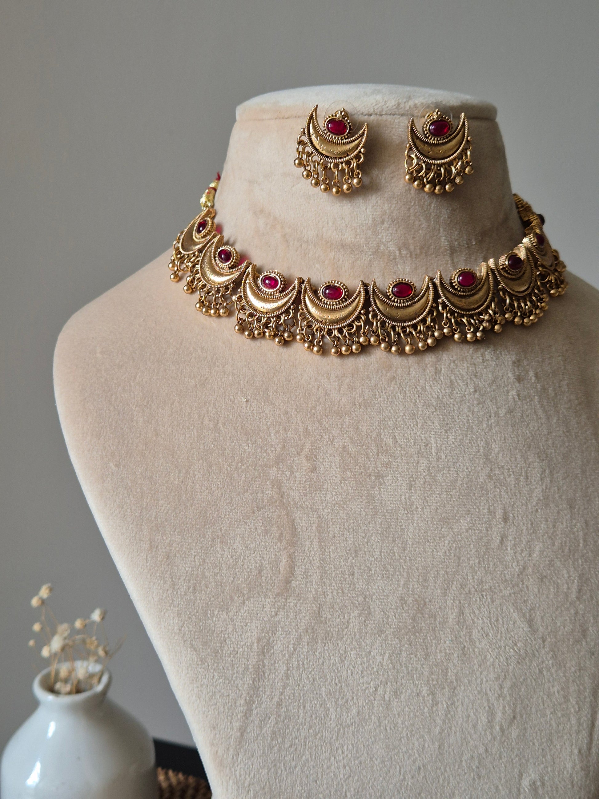Golden necklace set, Girija by Naitri, simple design on white.
