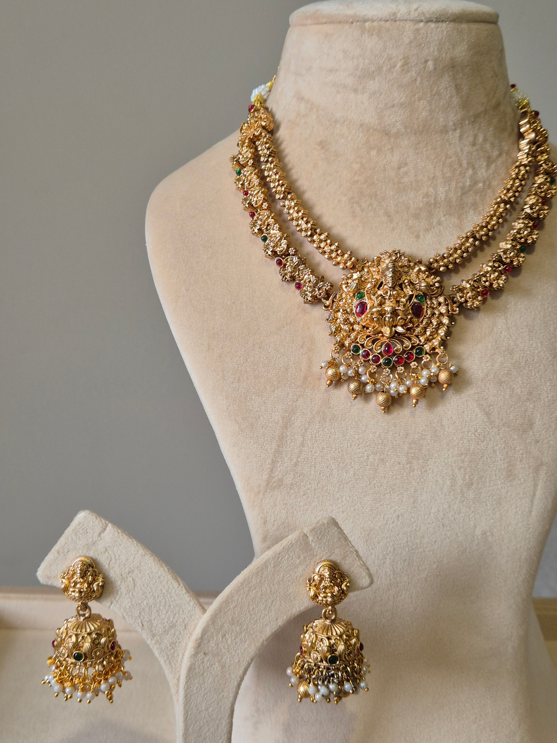 Gold necklace set, Aruna by Naitri, premium festive jewelry on white background.