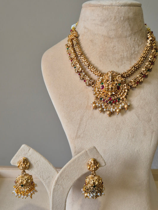 Gold necklace set, Aruna by Naitri, premium festive jewelry on white background.