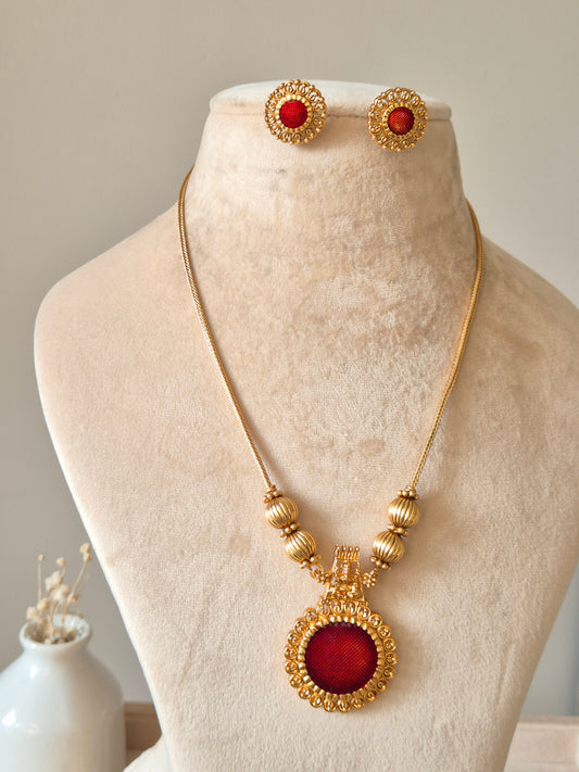 Golden necklace set, Arundhati by Naitri, shown with pendant and earrings.
