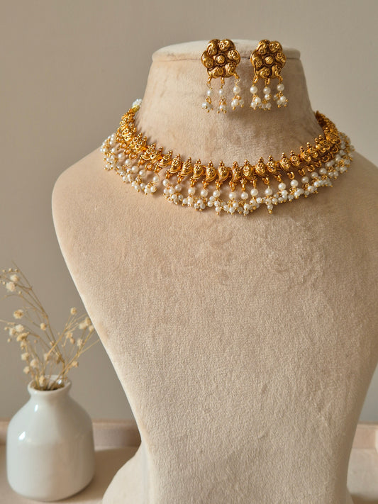 Gold necklace set, Rini by Naitri, traditional design with temple motifs.