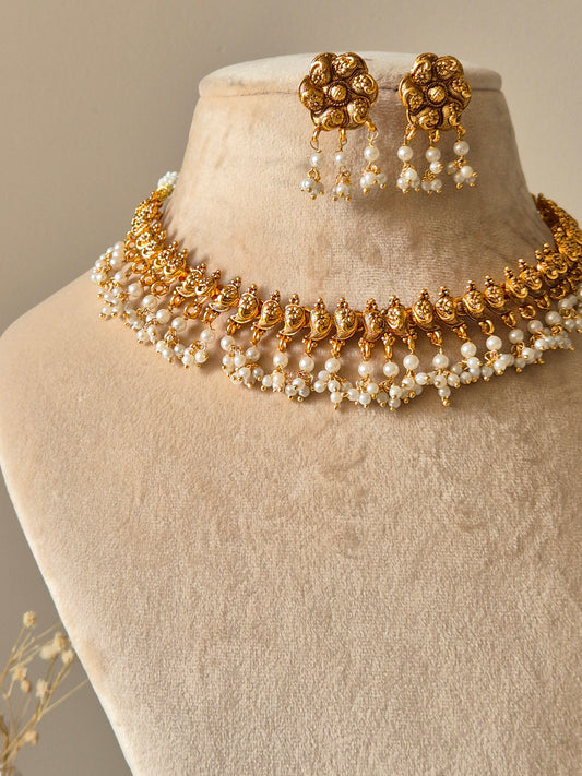 Gold necklace set, Rini by Naitri, traditional design with temple motifs.