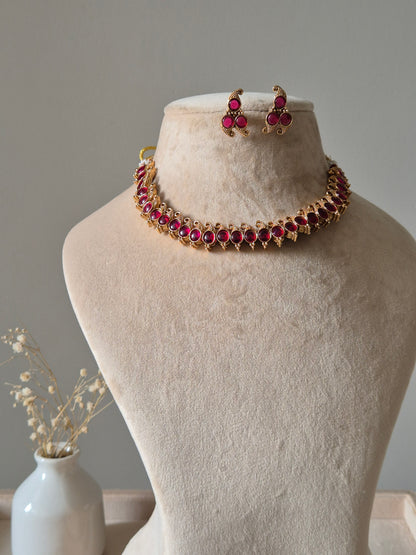 Reversible gold pendant necklace set, Kavi by Naitri, with stud earrings.