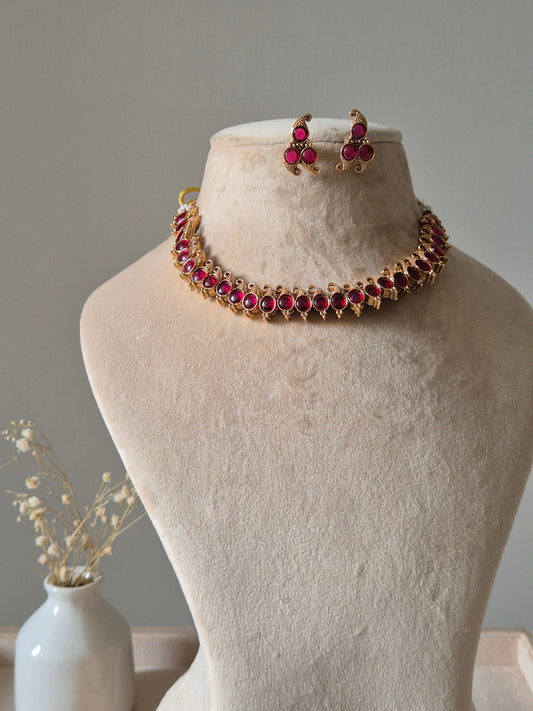 Reversible gold pendant necklace set, Kavi by Naitri, with stud earrings.