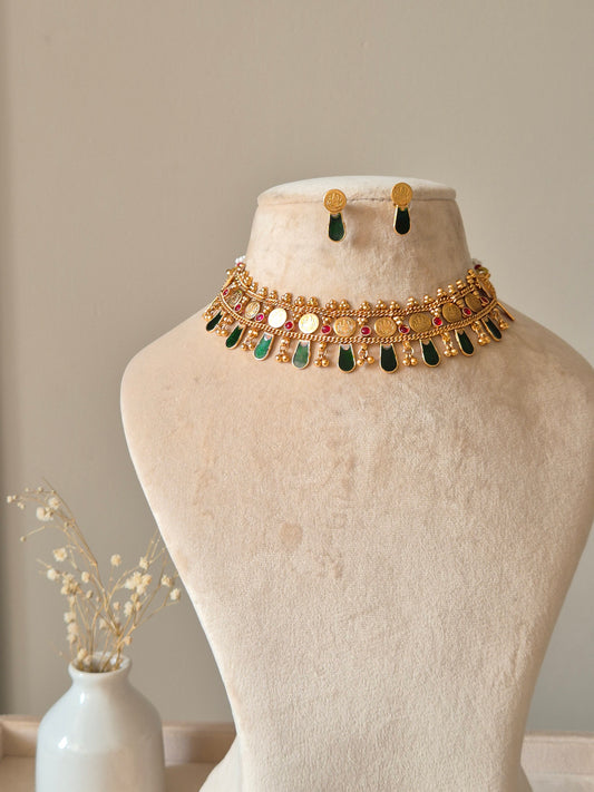 Gold choker necklace set, Meetu by Naitri on bust form.