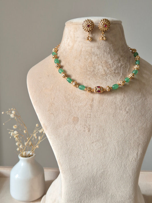 Green and gold statement necklace set with matching earrings, Ishira by Naitri.