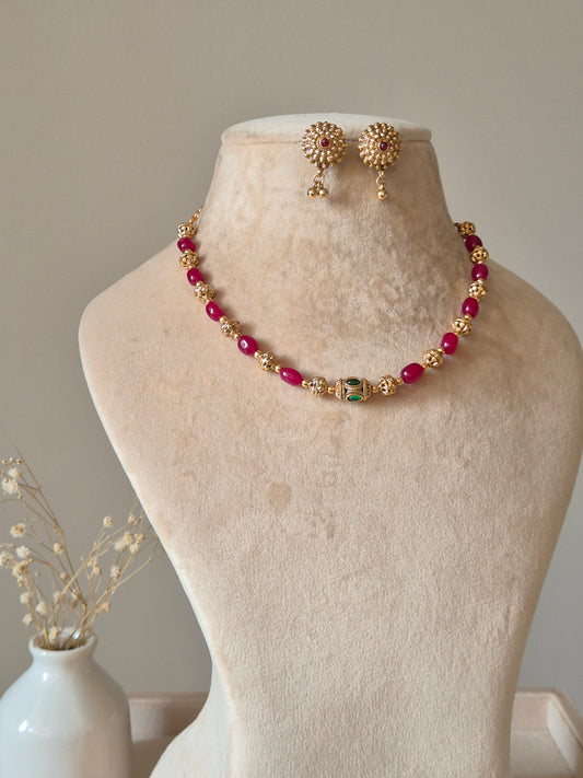 Red and gold beaded necklace set, Diya by Naitri with matching earrings.