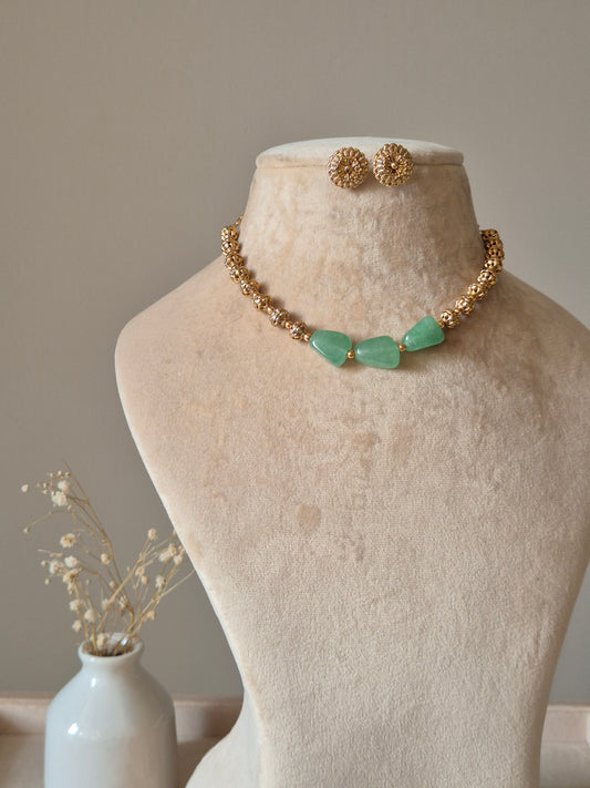 Gold and green beaded necklace set, Shifa by Naitri, displayed on bust.
