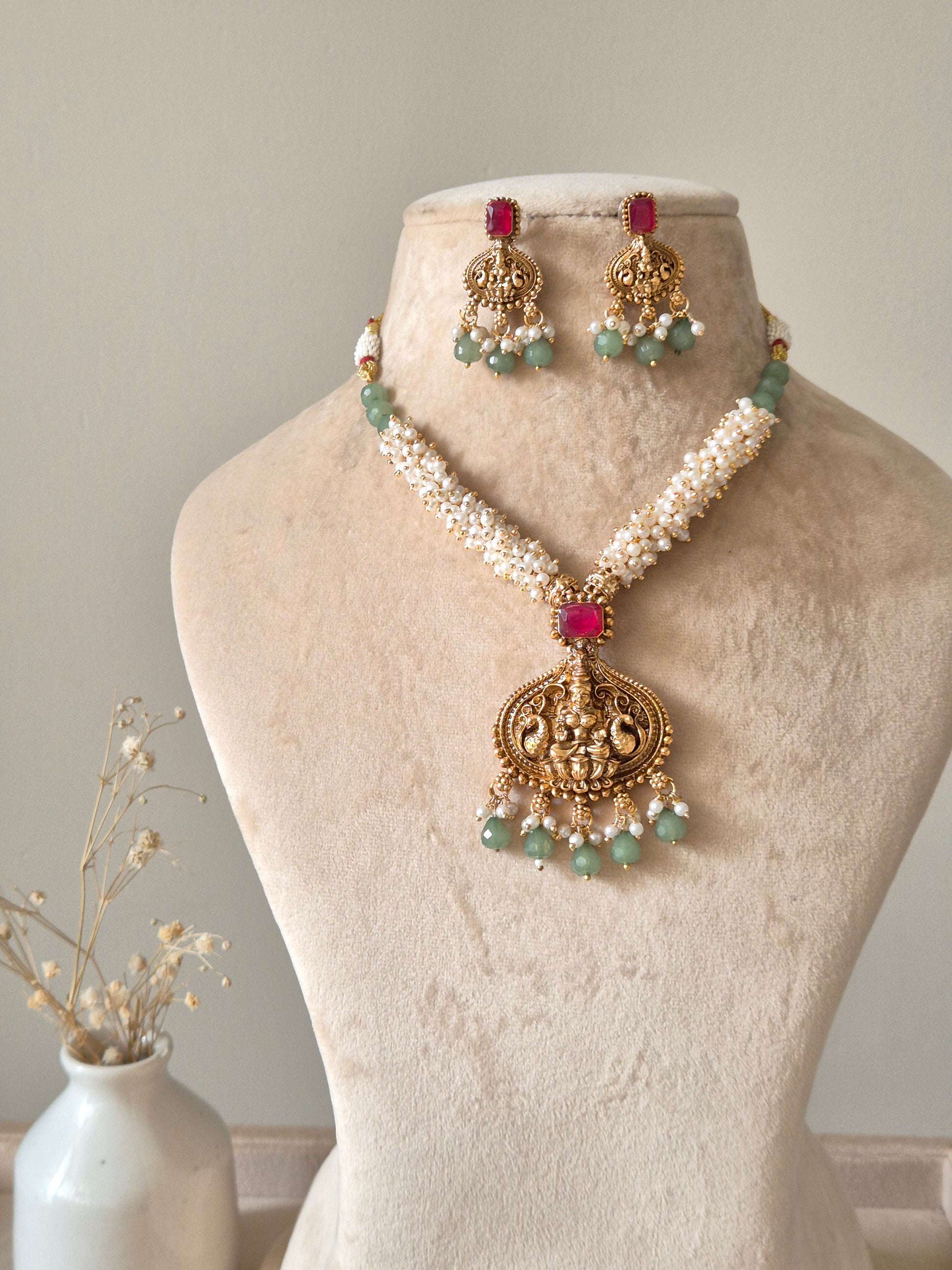 Multi-strand gold beaded necklace set, Richa by Naitri, with statement earrings.