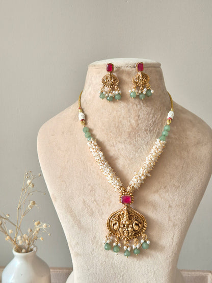Multi-strand gold beaded necklace set, Richa by Naitri, with statement earrings.