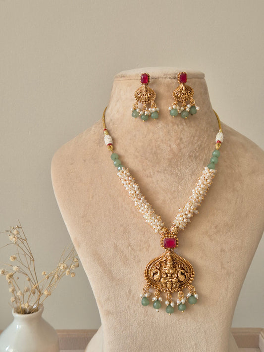 Multi-strand gold beaded necklace set, Richa by Naitri, with statement earrings.