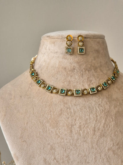 Blue and gold necklace set with clear stones, Tarang by Naitri on bust.
