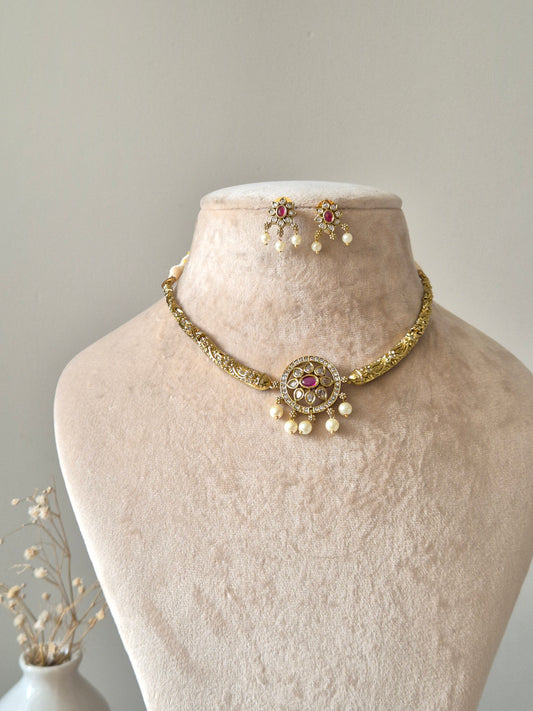 Gold necklace set with matching earrings, Vasundhra by Naitri on white background.