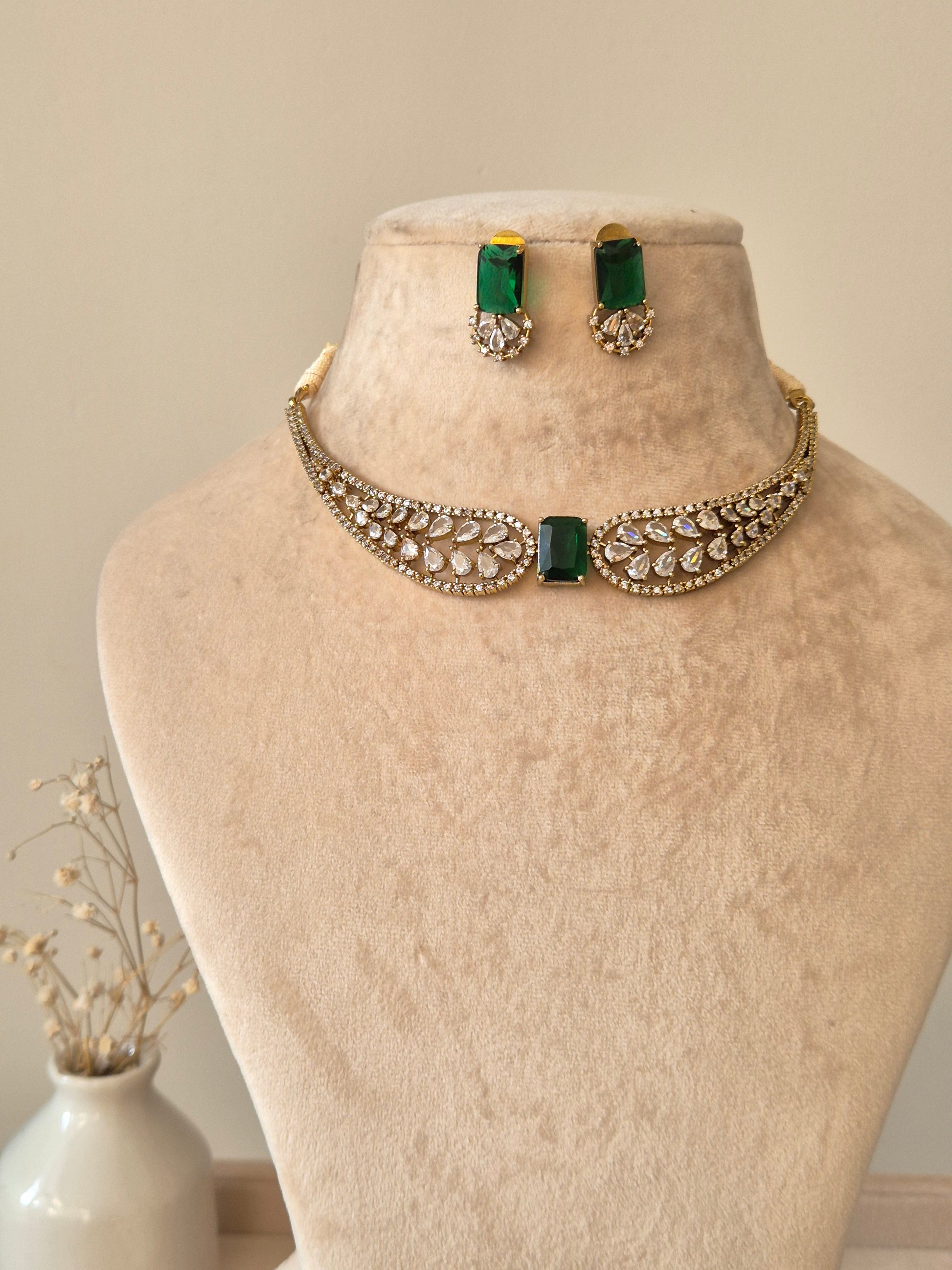 Polished gold necklace set with American diamond stones, Krishvi by Naitri.